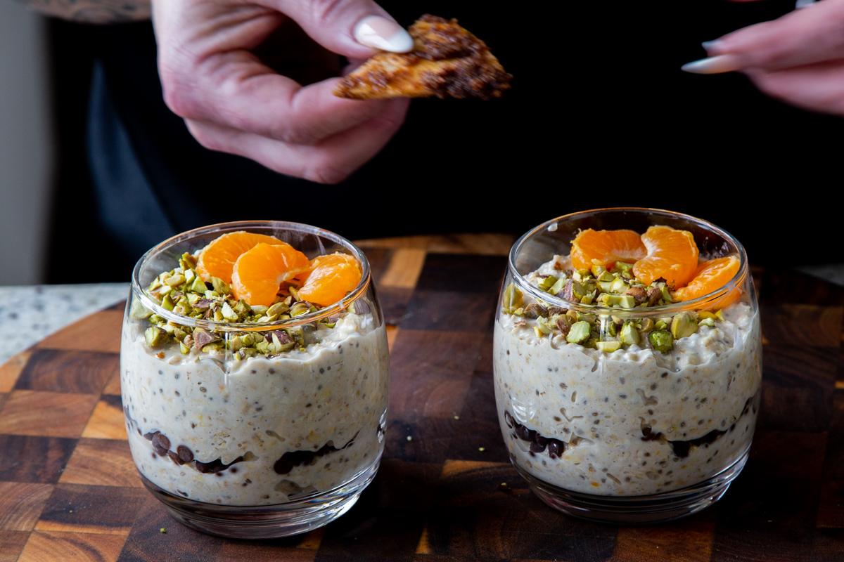 adding the crispy cinnamon tortilla pieces to the cannoli overnight oats