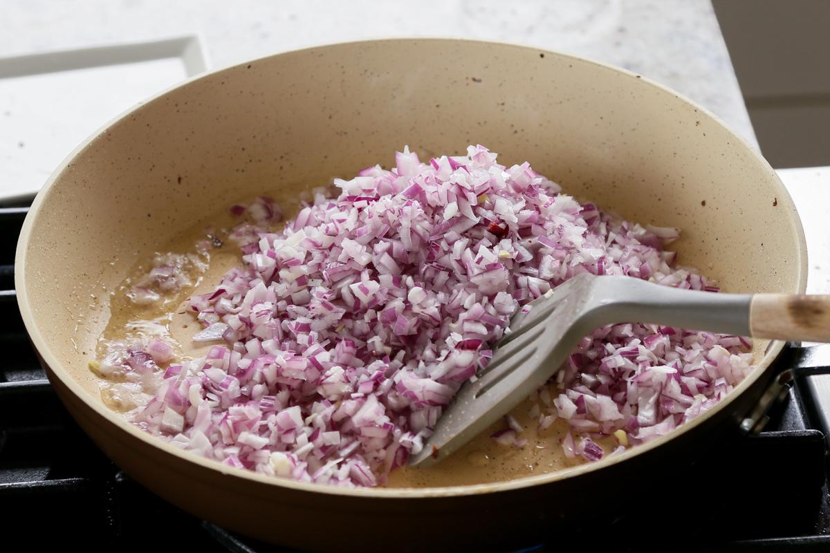 adding onion and salt to the skillet