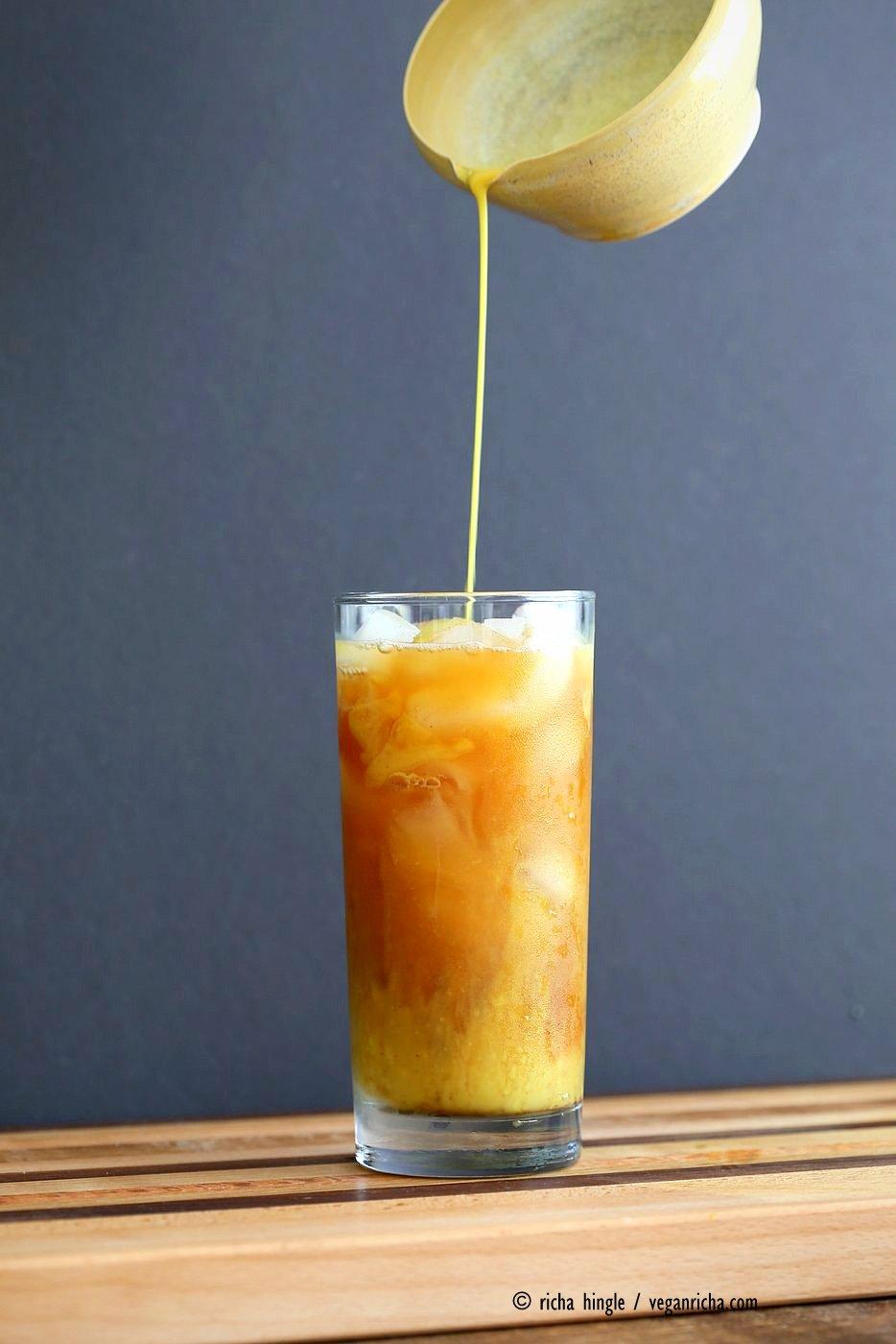 Cardamom Cinnamon Turmeric Iced Tea. Spiced Iced tea like Thai Iced tea with turmeric coconut milk and Indian masala chai spices and ginger. Golden Milk Iced Tea. Vegan Gluten-free Soy-free Recipe | VeganRicha.com