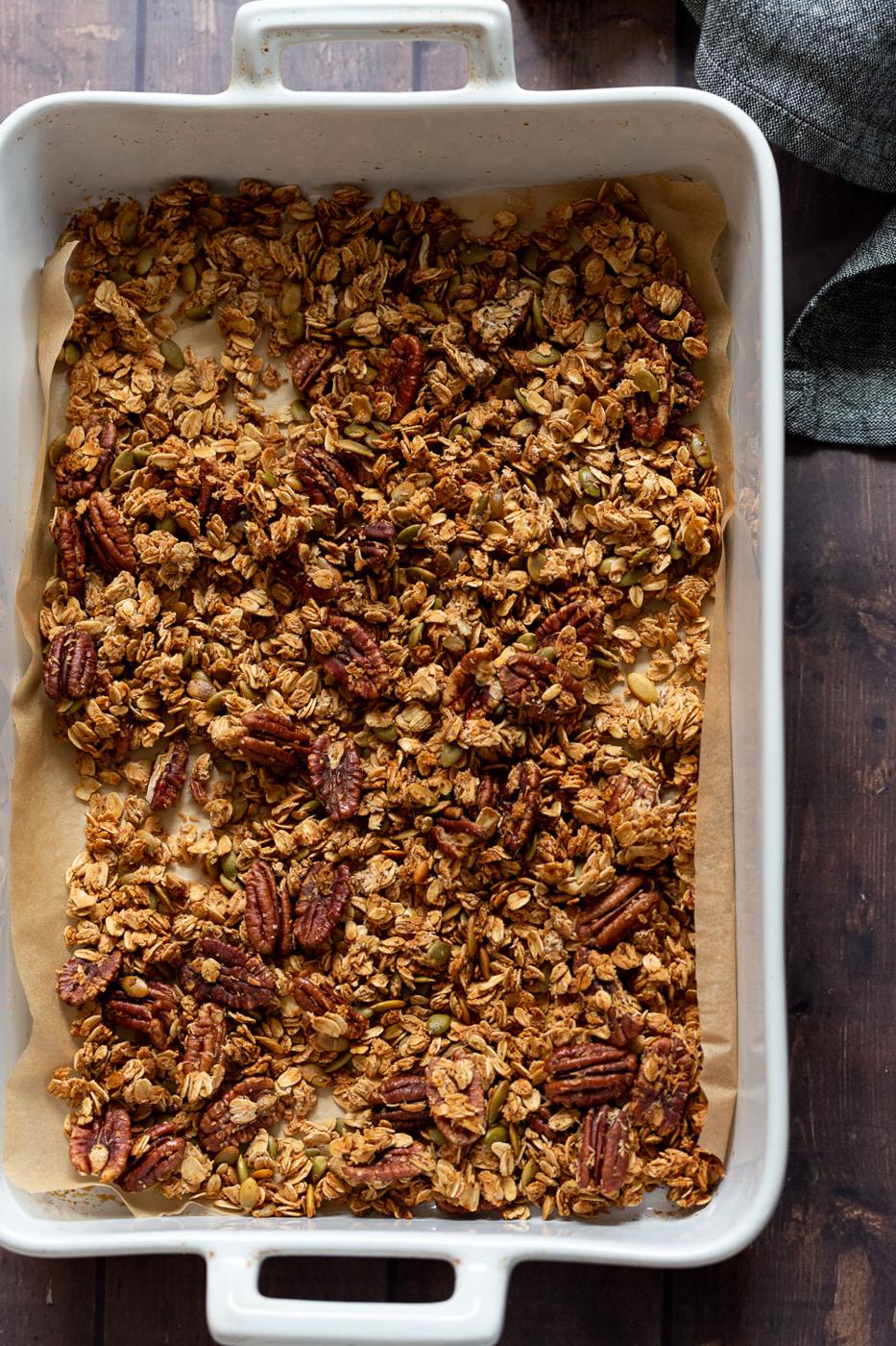 Our Vegan Maple Pecan Granola in a white baking dish