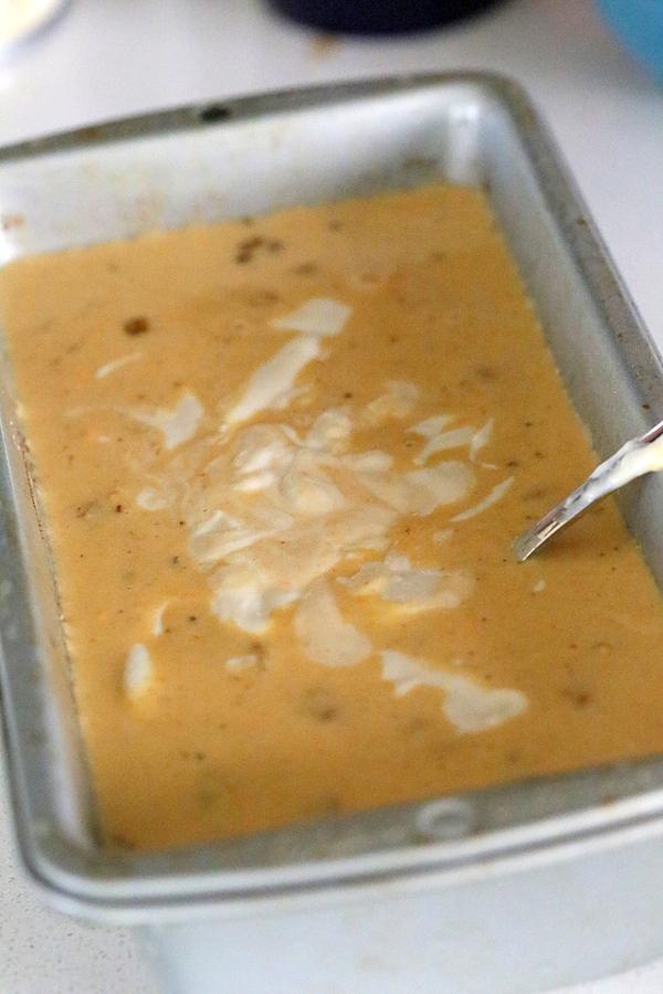 vegan carrot cake ice cream base being swirled with a fork