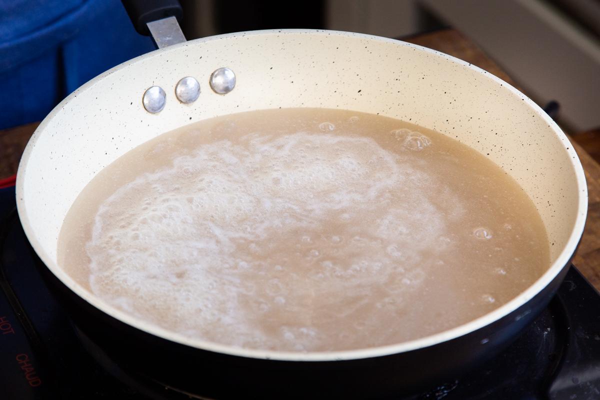 coconut milk and sugar in a sauteeing pan