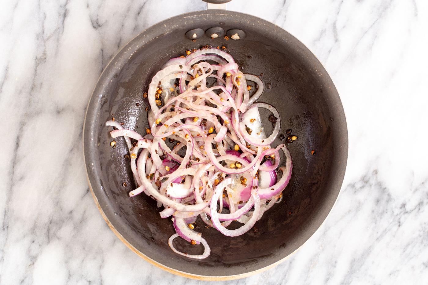 onion and tempered Indian spices in a sauteeing pan