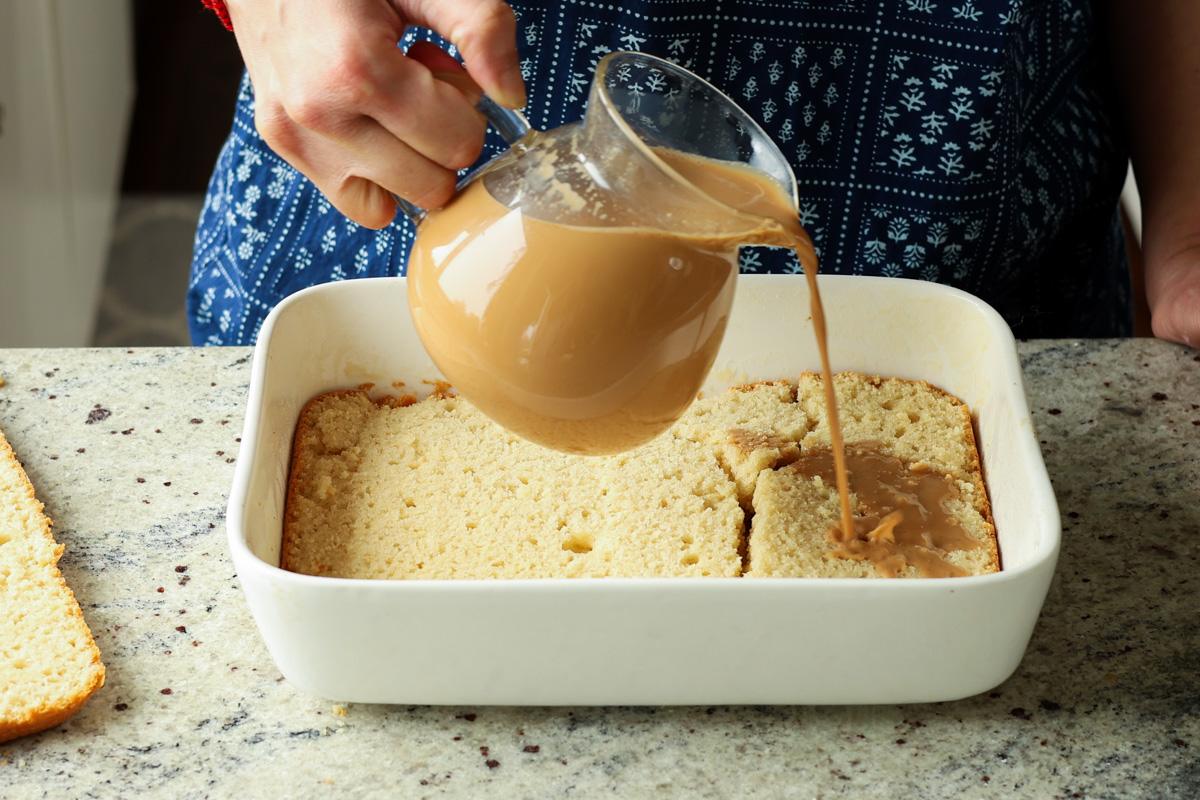 pouring the chai onto first the cake layer