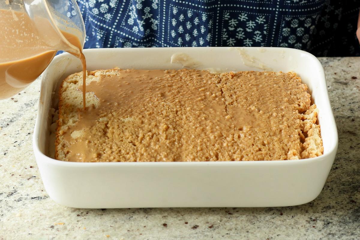 pouring the chai onto second cake layer