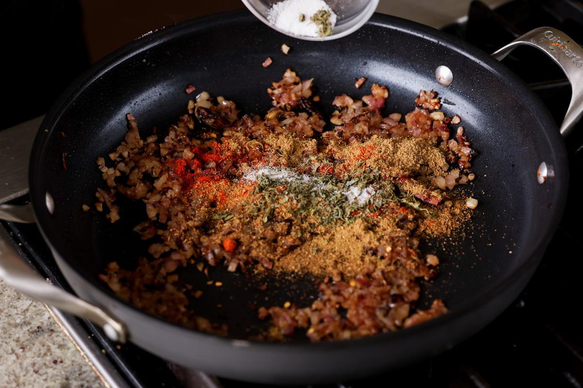 adding ground spices to the pan