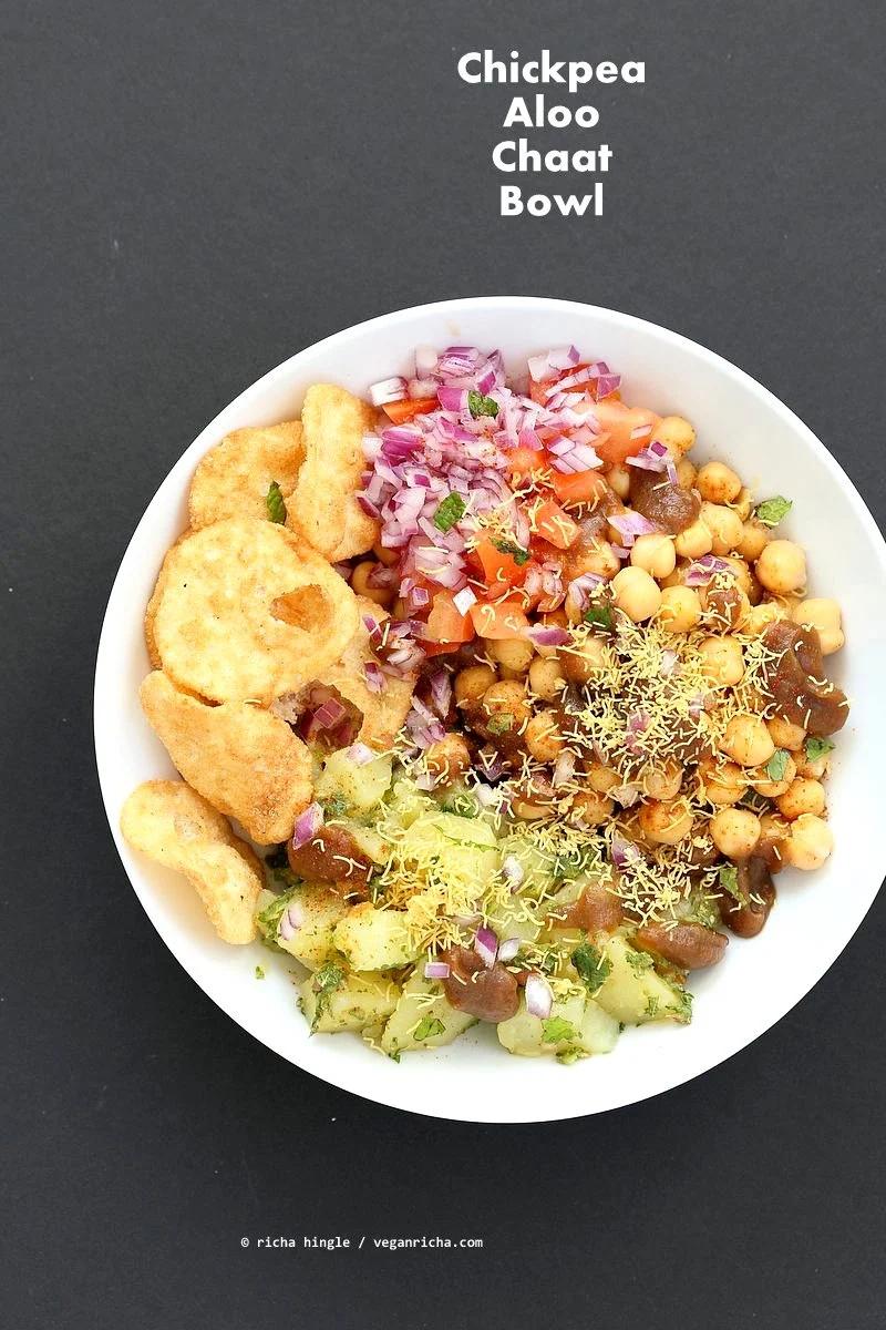Chickpea Aloo Chaat Bowl. Mint cilantro Potatoes, spiced chickpeas, tamarind date chutney bowl with onions, tomatoes and chaat masala. | VeganRicha.com #vegan #glutenfree #bowl #recipe