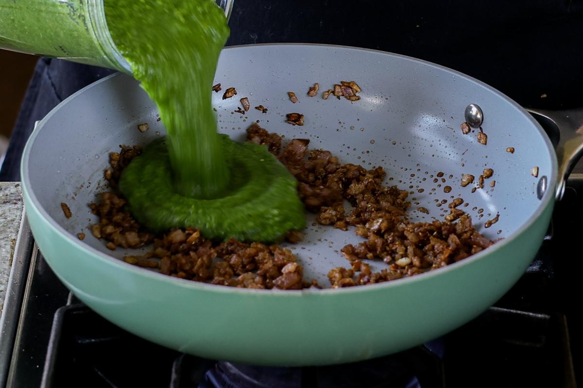 adding spinach puree to the cooked onions