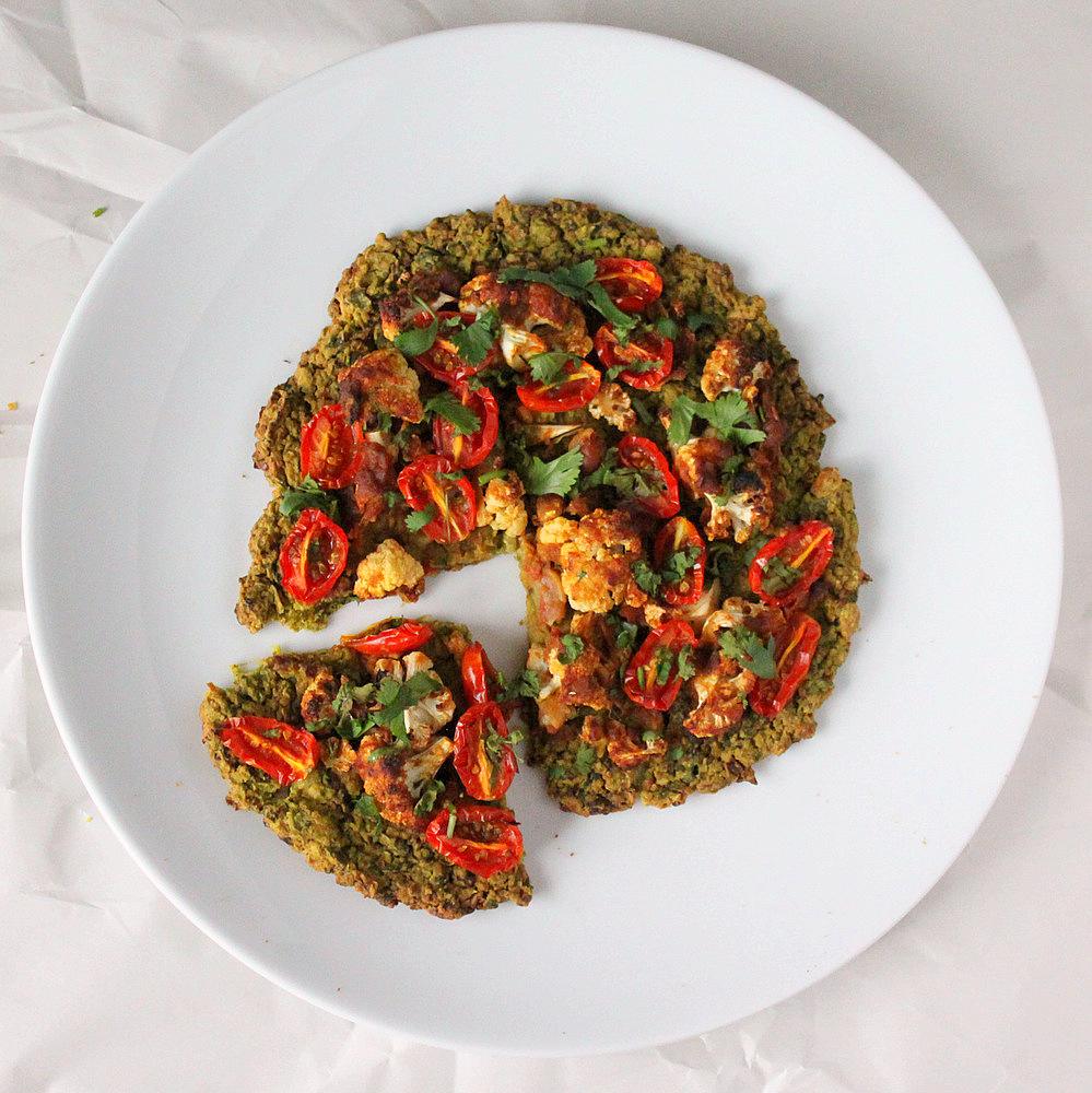 Chickpea Quinoa Chard Pizza topped with Roasted Cauliflower and grape tomatoes. vegan glutenfree nutfree