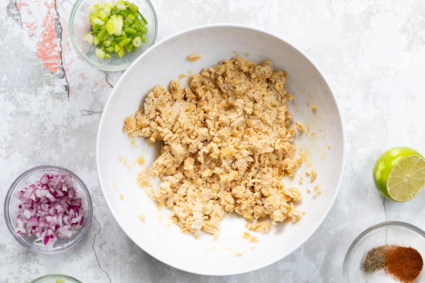 Mashed Chickpeas and Tahini for our Chickpea Tahini Salad Sandwich in a white bowl
