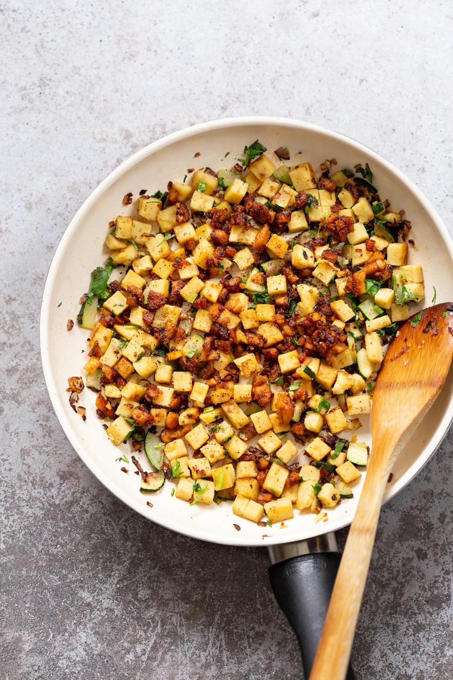 Chickpea Tofu Breakfast Scramble on a white skillet