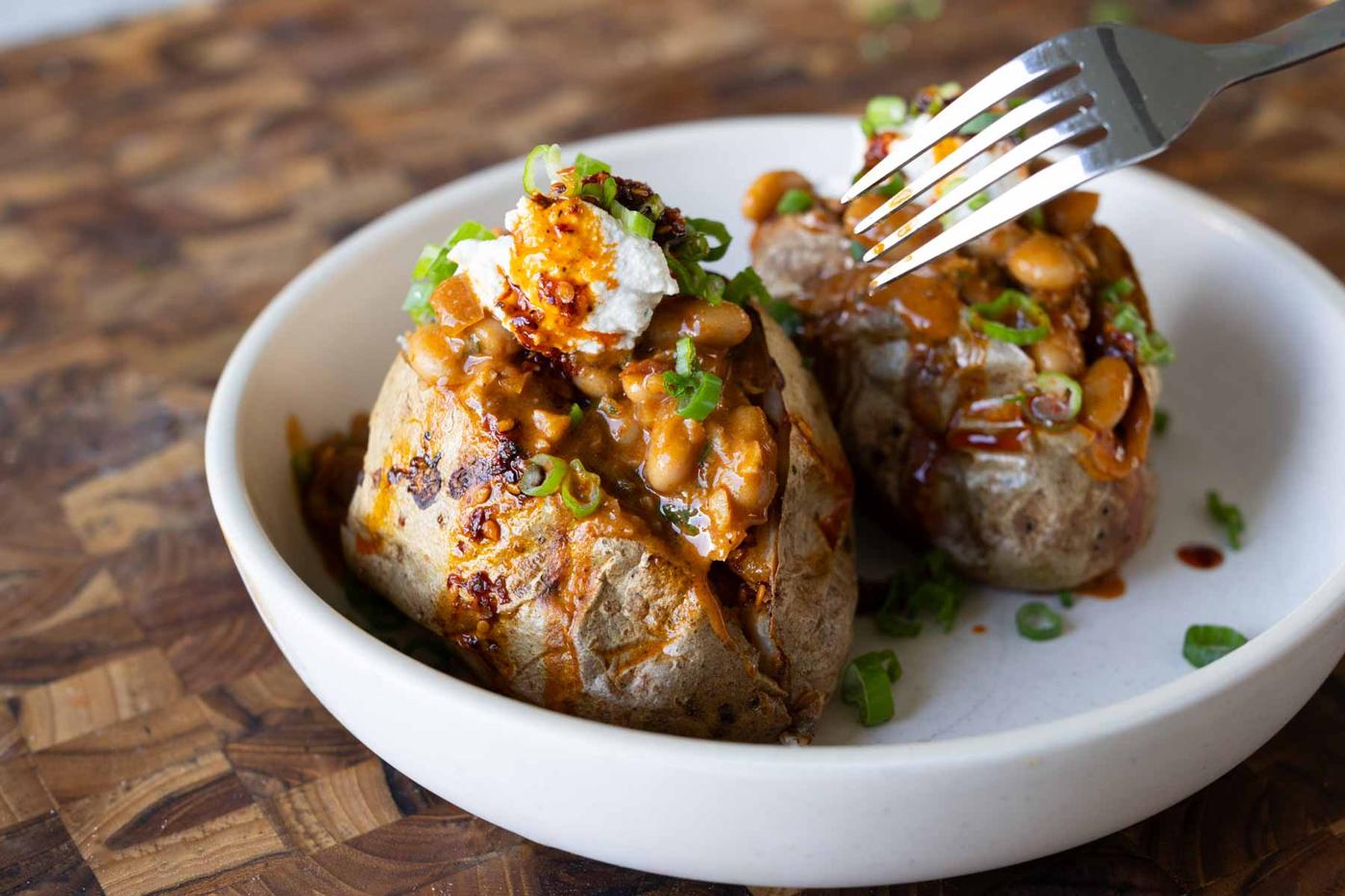 baked potatoes topped with the chili garlic beans