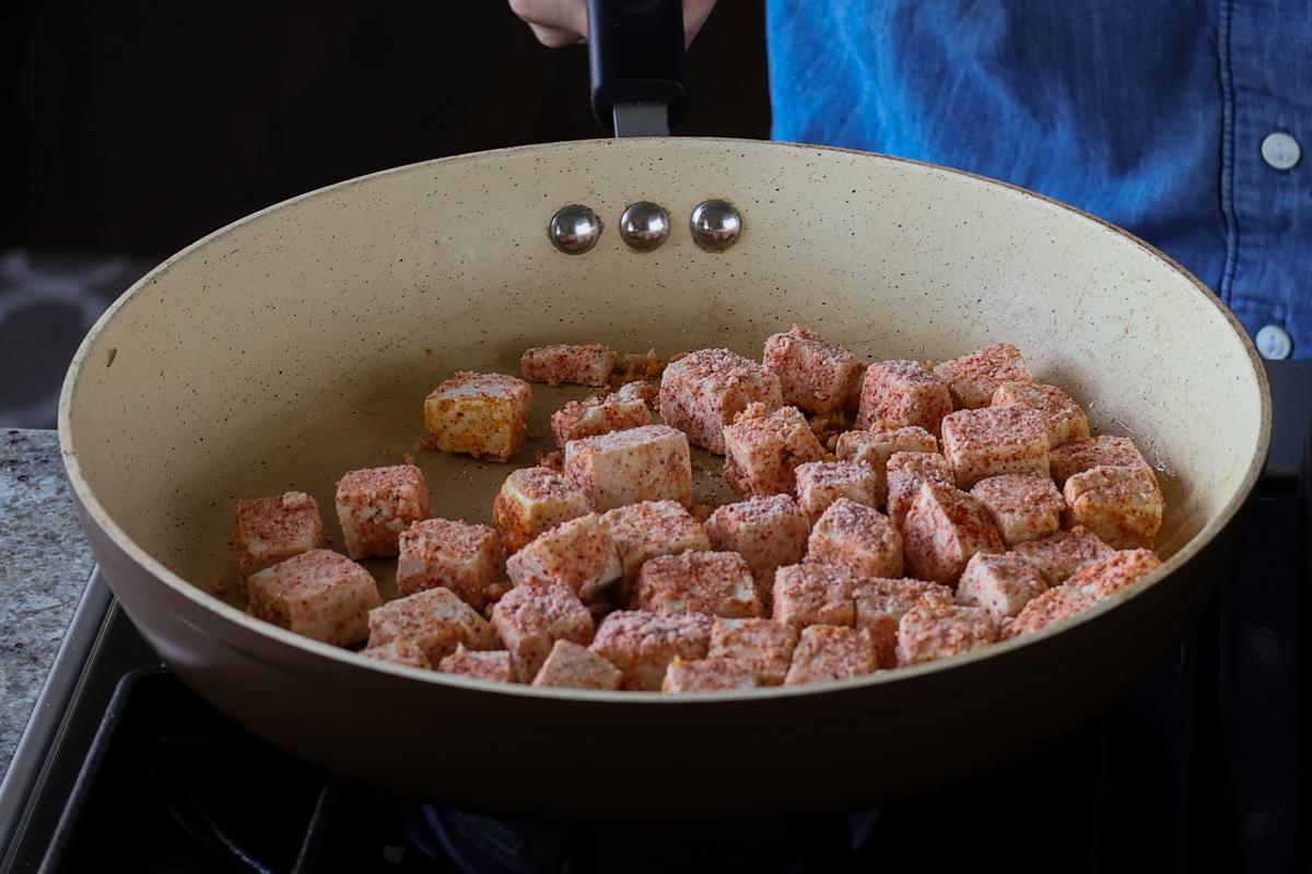 tofu in the pan before flipping