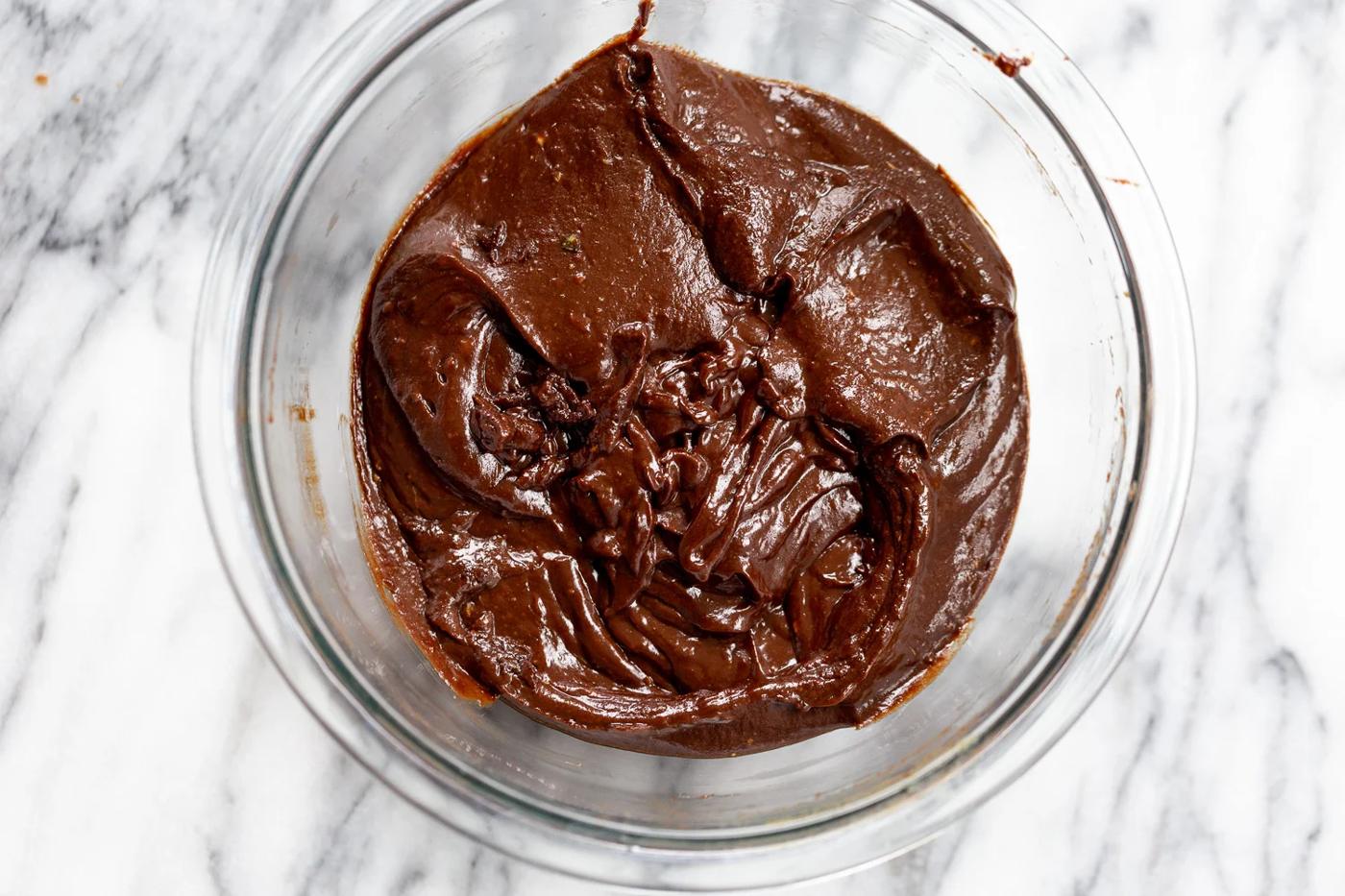 Chocolate avocado fudge mixture in a glass bowl