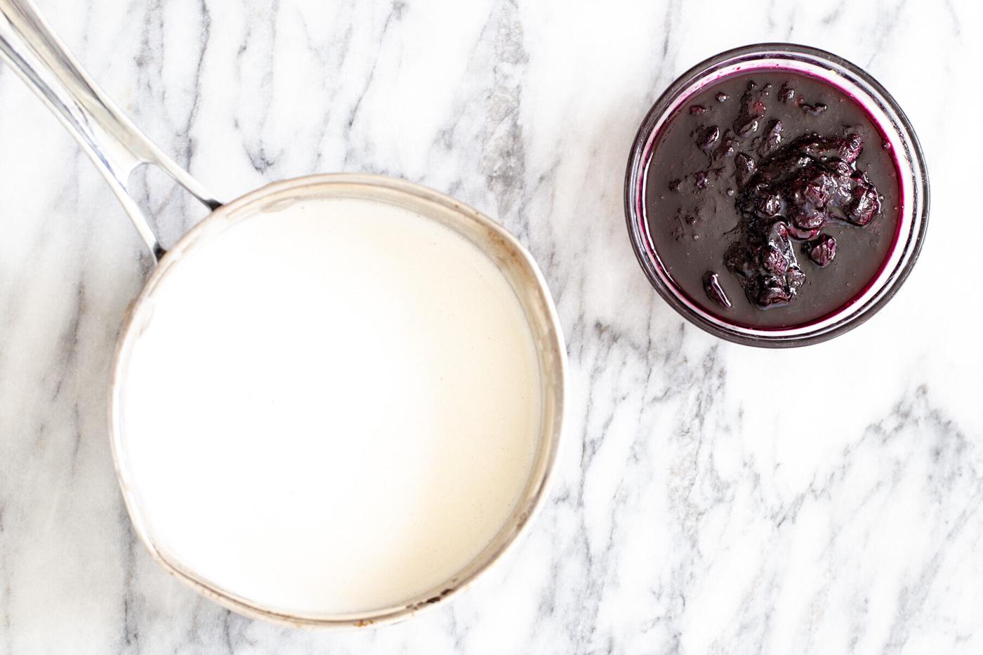 a pot with vegan vanilla ice cream base next to a small dish with blueberry compote