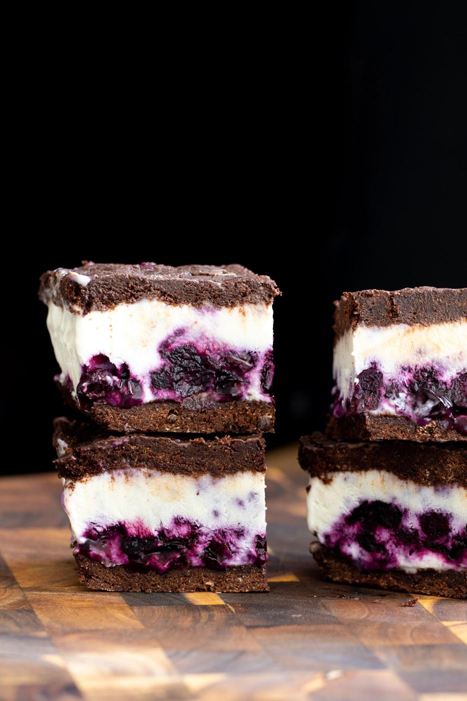 vegan vanilla blueberry swirl ice cream sandwiches on a chopping board