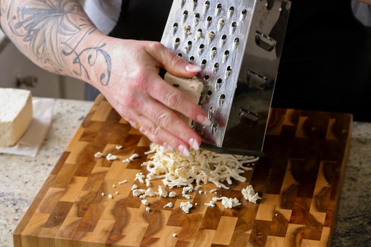 grating the tofu with a box grater