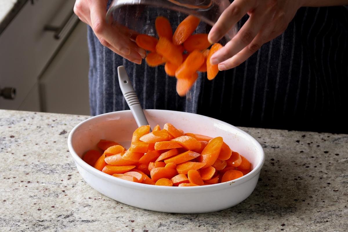adding carrots to the pan