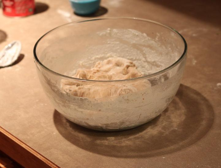 vegan cinnamon bun dough in a glass bowl