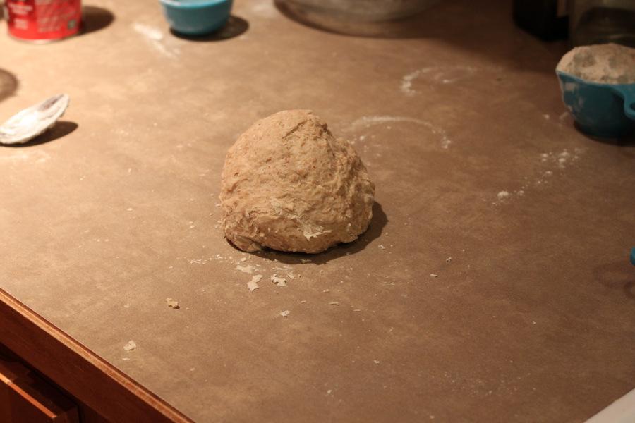 cinnamon rolls dough shaped into a ball on a kitchen counter ready to be rolled out