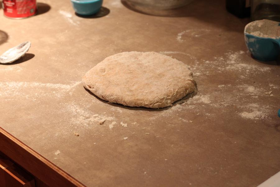 dairy-free yeasted dough for cinnamon rolls being rolled out into a rectangle