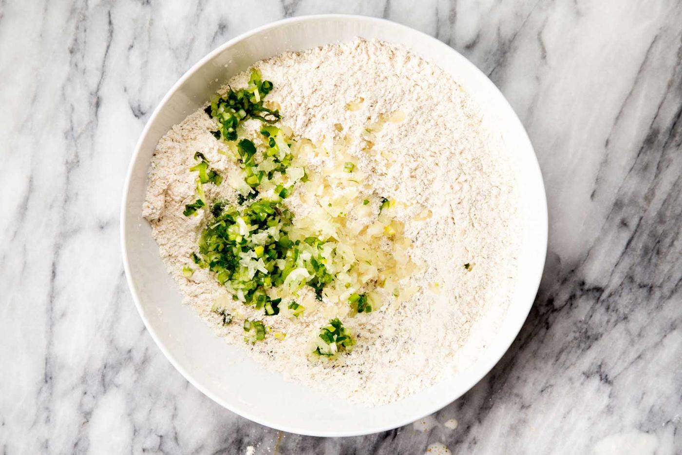 adding aromatics to flour and spices