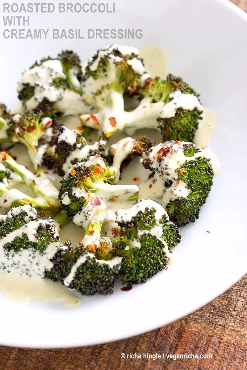 Roasted Broccoli with Creamy Basil Dressing. Broccoli tossed in garlic, cayenne, and baked. Served with cheesy cashew basil sauce. Vegan Gluten-free soy-free Recipe | VeganRicha.com