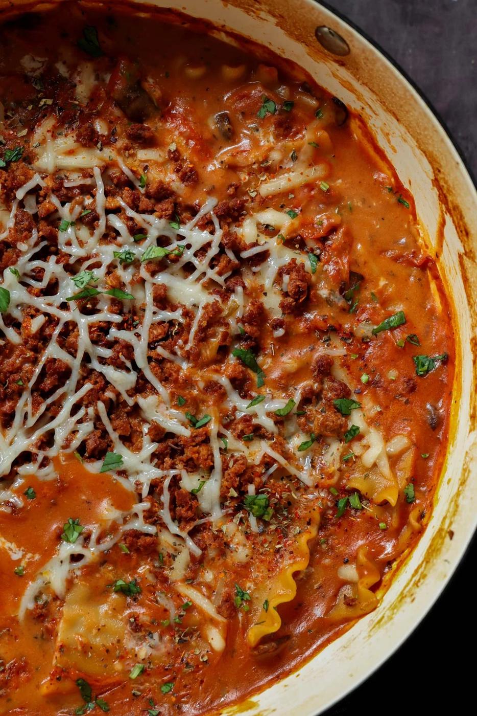 close-up of creamy lasagna soup in the pan after cooking