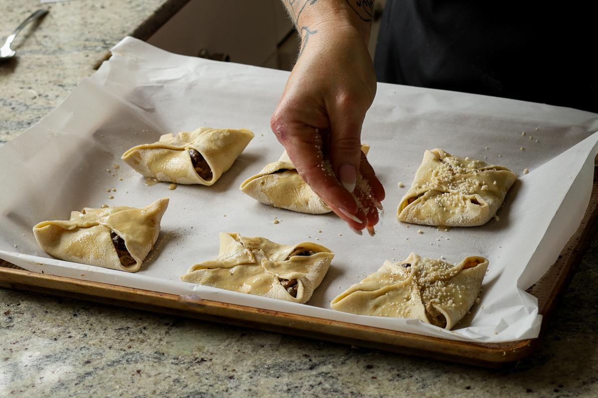 sprinkling seeds onto the mushrooms puffs