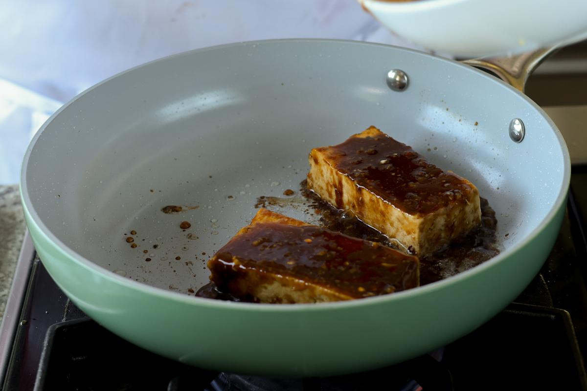 teriyaki tofu in the pan after adding more sauce