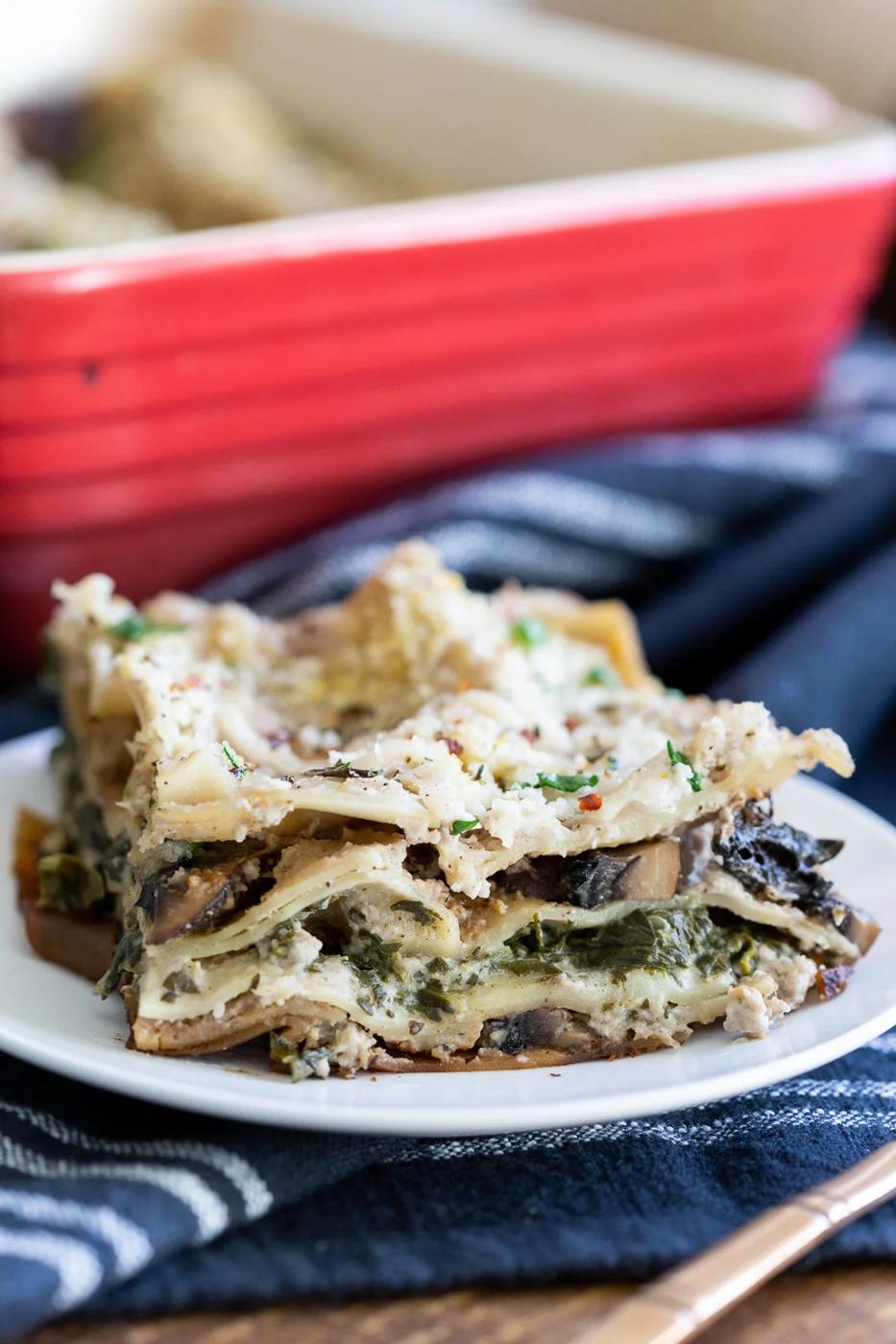 Our Creamy Vegan Mushroom Lasagna slice on a white plate