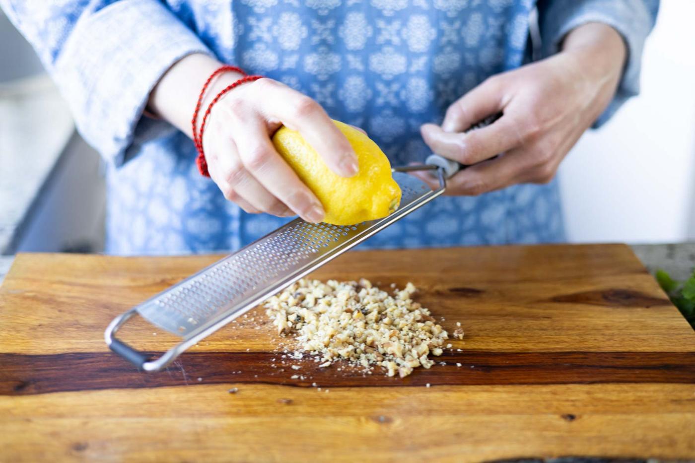 adding lemon zest to the reserved walnuts