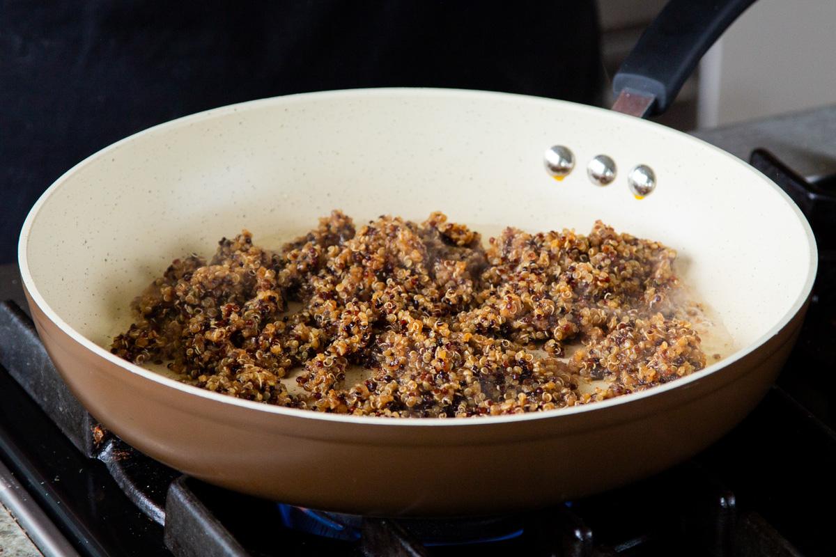 adding the quinoa taco meat to a frying pan