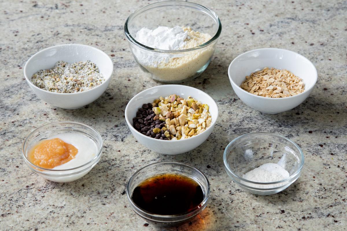 almond flour, nuts, seeds, chocolate, and other baking ingredients on a kitchen counter