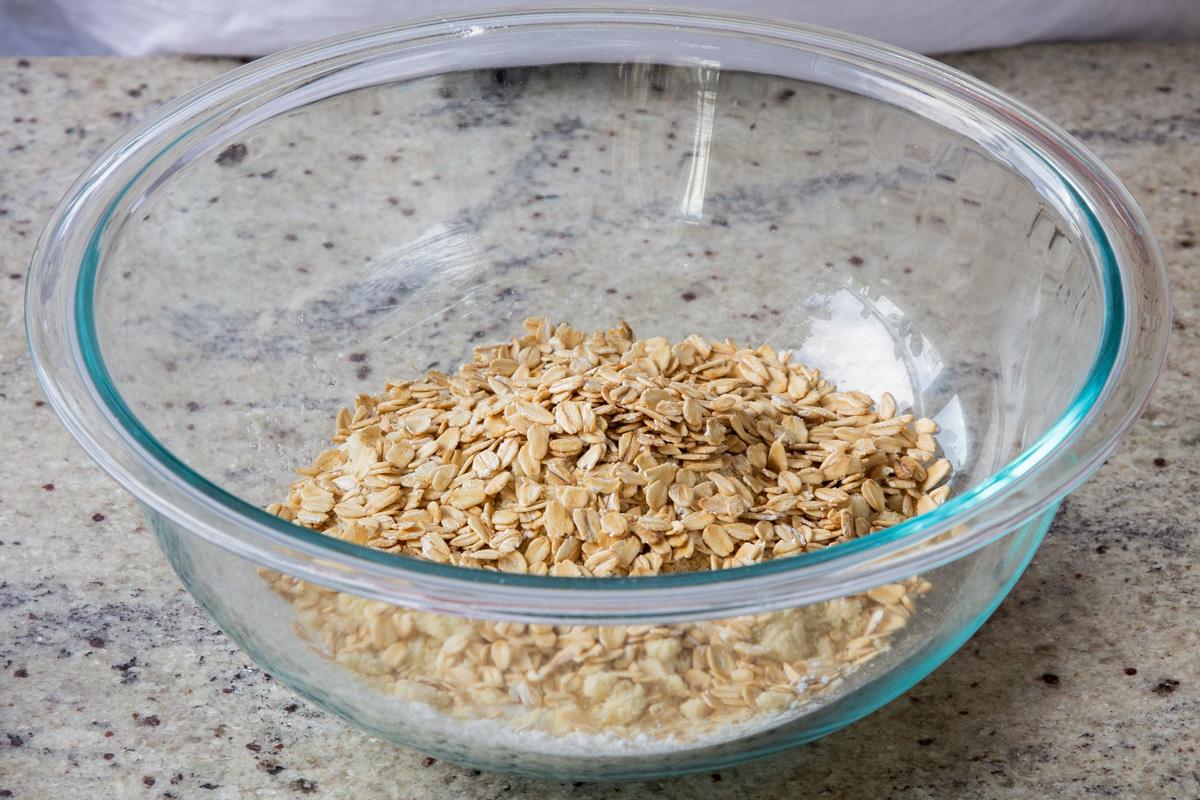 adding oats to the bowl
