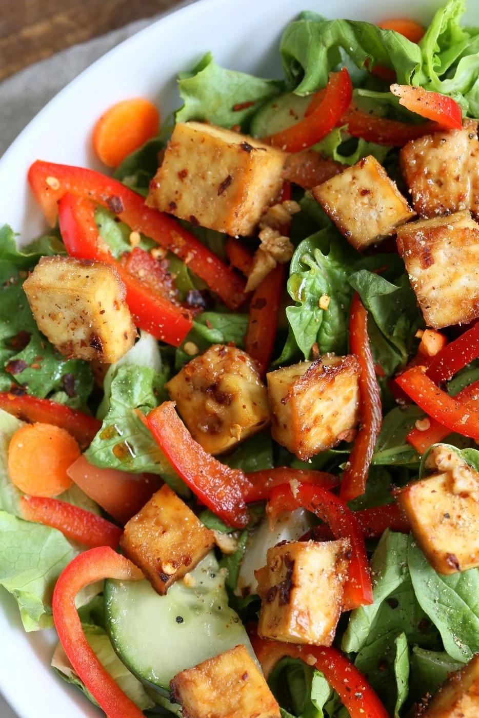 Crunchy Asian Salad With Baked Tofu & Garlic Soy Maple Dressing. Marinated and Baked Tofu over Crunchy Greens, peppers and carrots. Vegan Gluten-free Recipe | VeganRicha.com