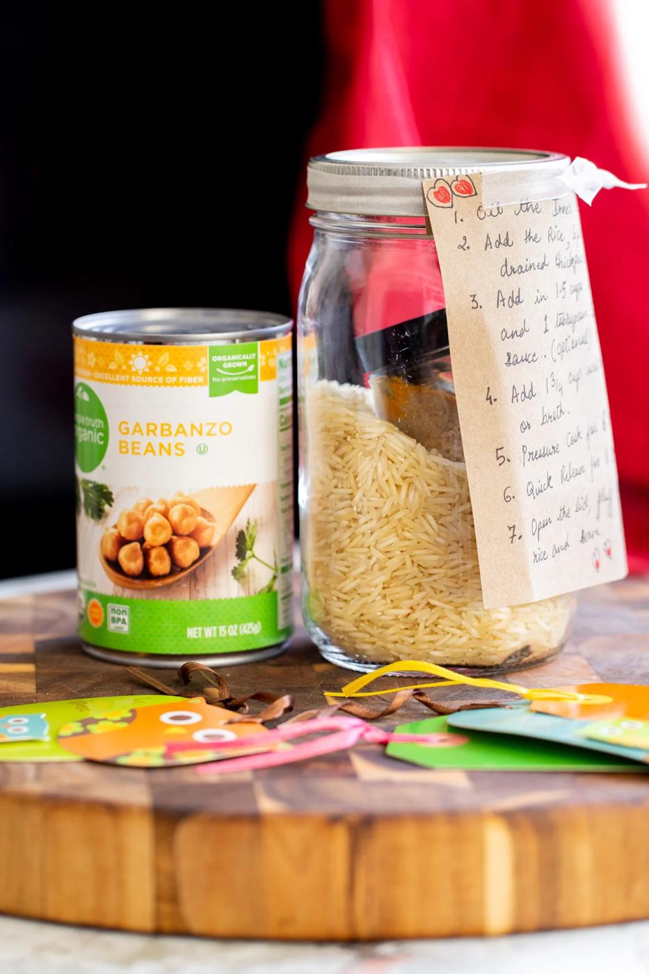 can of chickpea next to a jar with chickpea fried rice mix