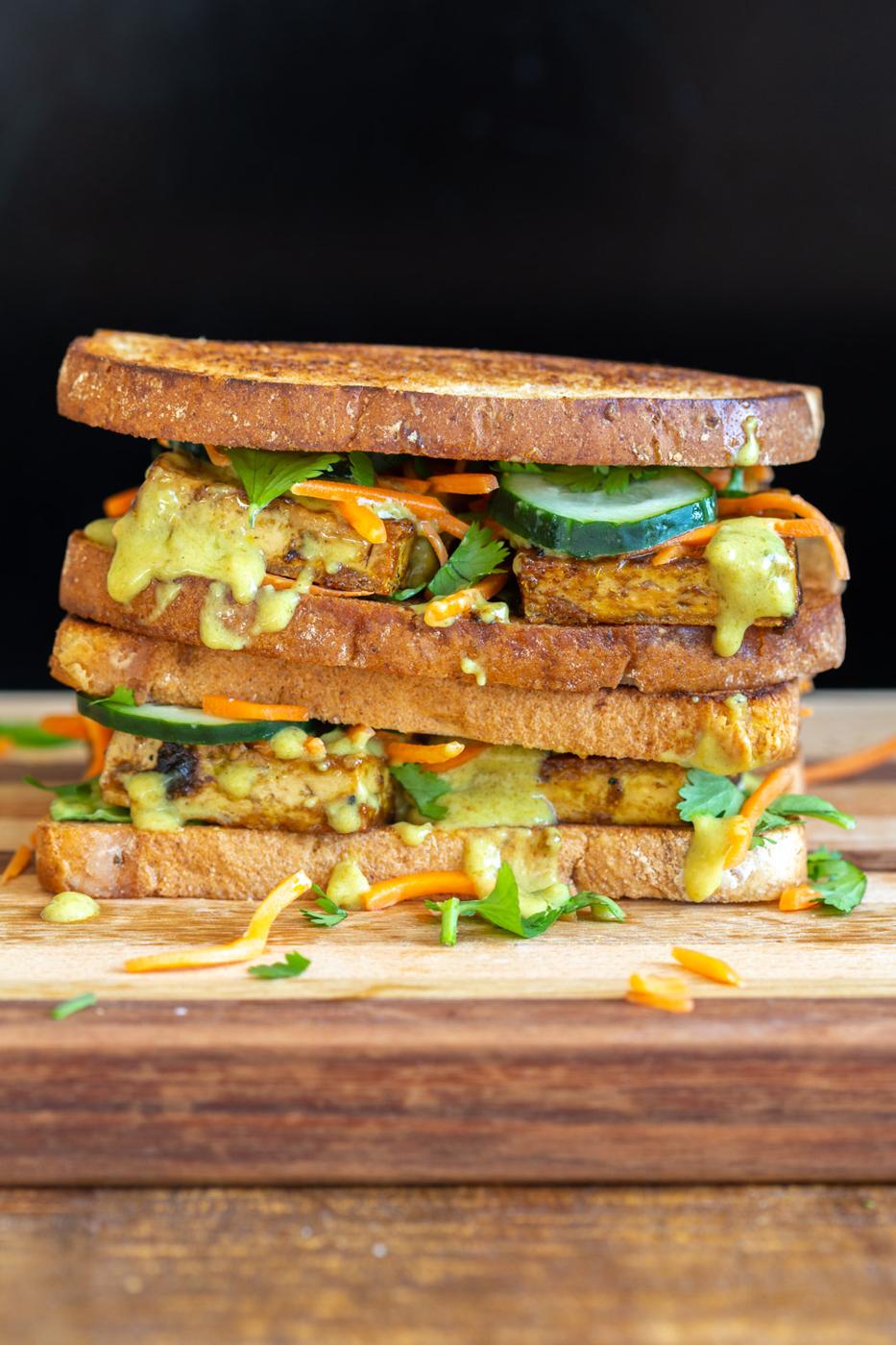 Curried Tofu Banh Mi Sandwich on a wood board