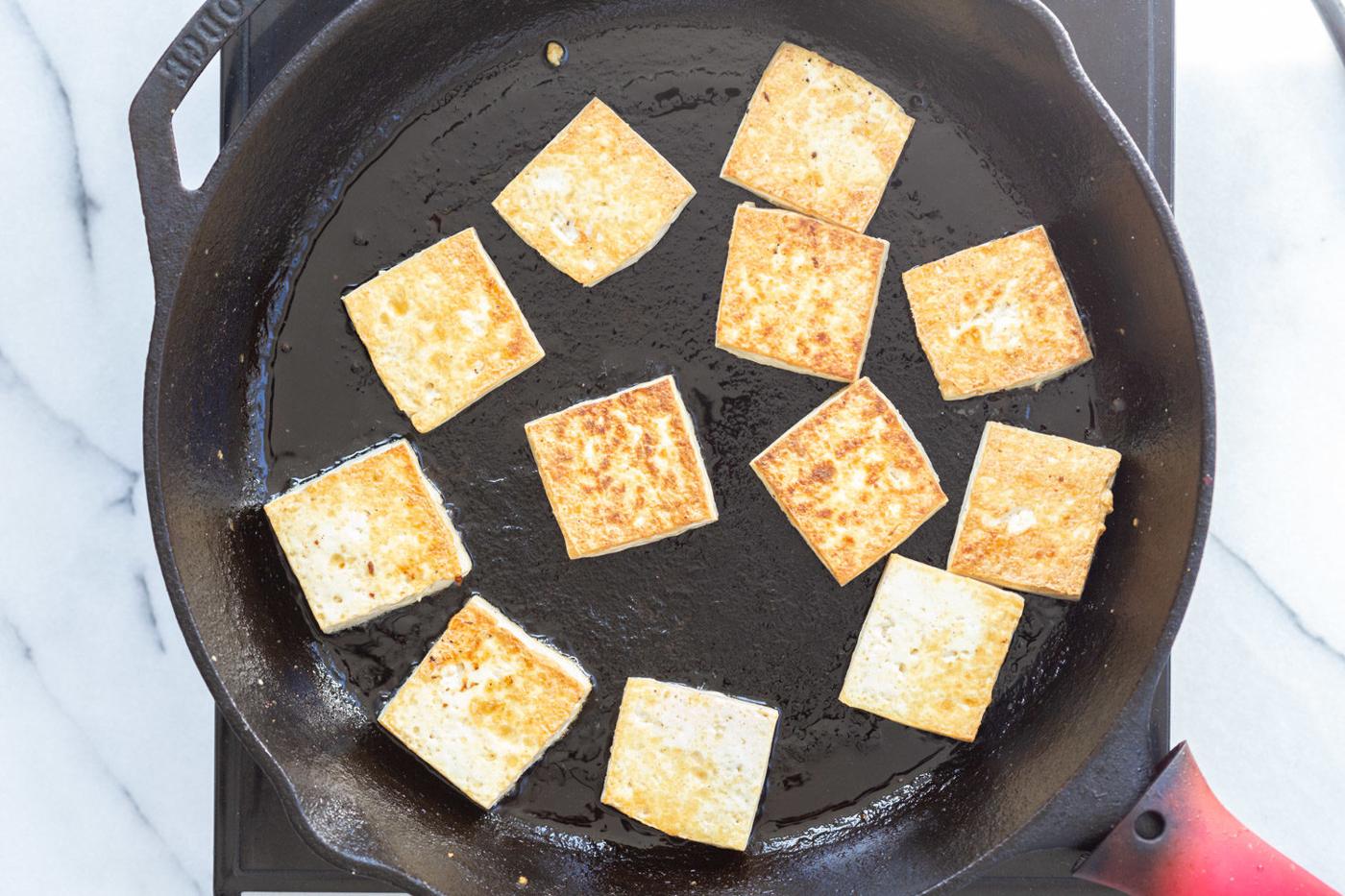 Tofu on a skillet for our Curried Tofu Banh Mi Sandwich