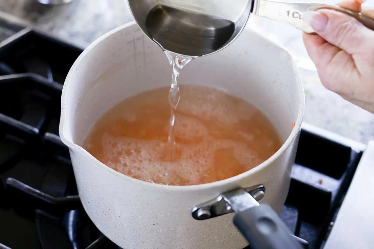 adding water to the lentils