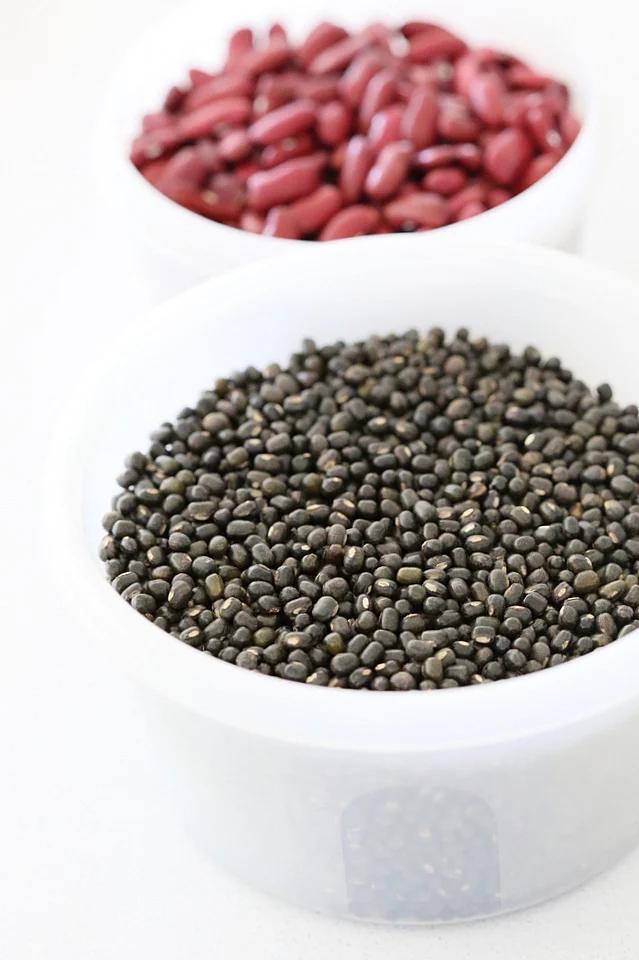 Whole Urad Lentils in a bowl for our Vegan Dal Makhani Recipe #veganricha #vegandalmakhani #instanpotdalmakhani