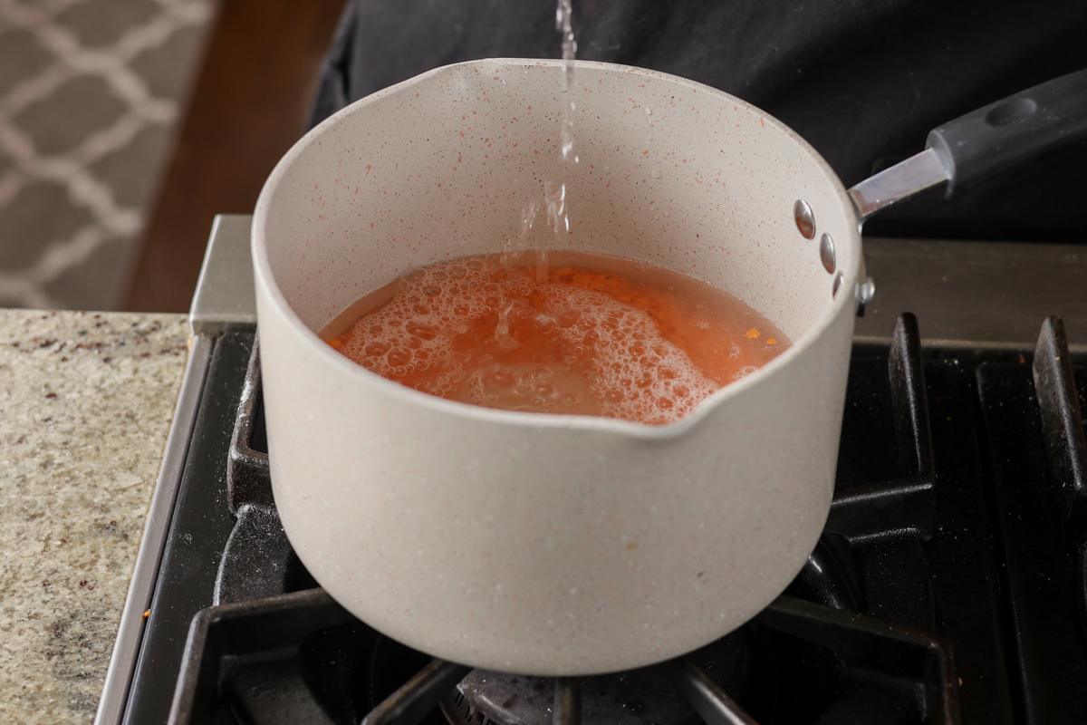 adding water to the lentils