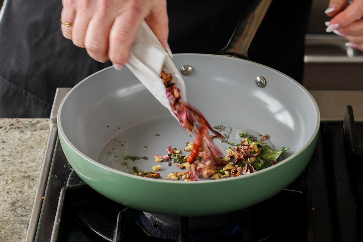 adding dried onion to the pan