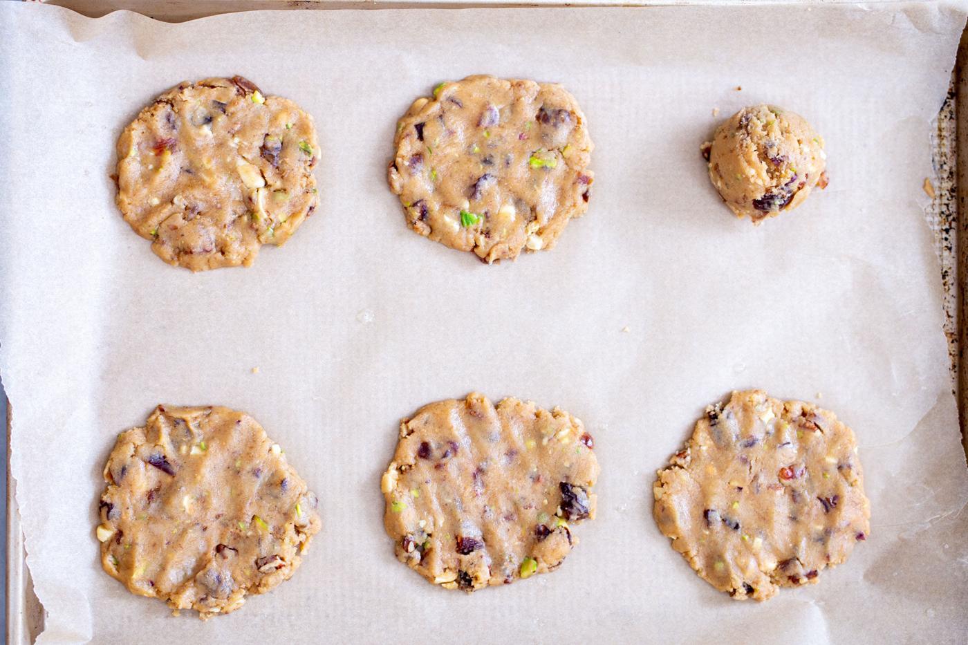 date nut cookies shaped and ready to make on a baking sheet