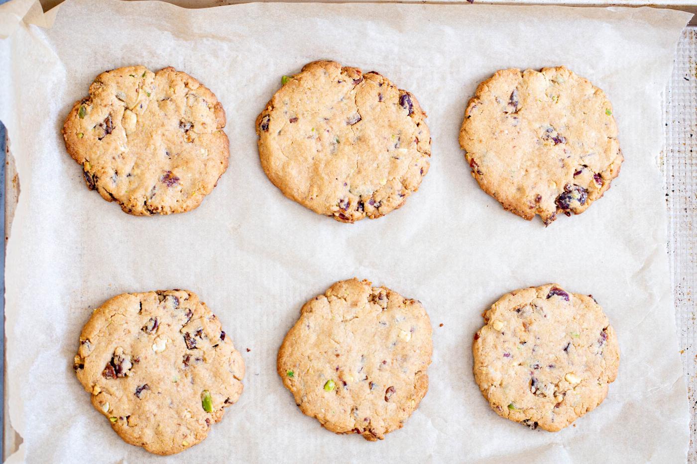 baked date nut cookies on a baking sheet