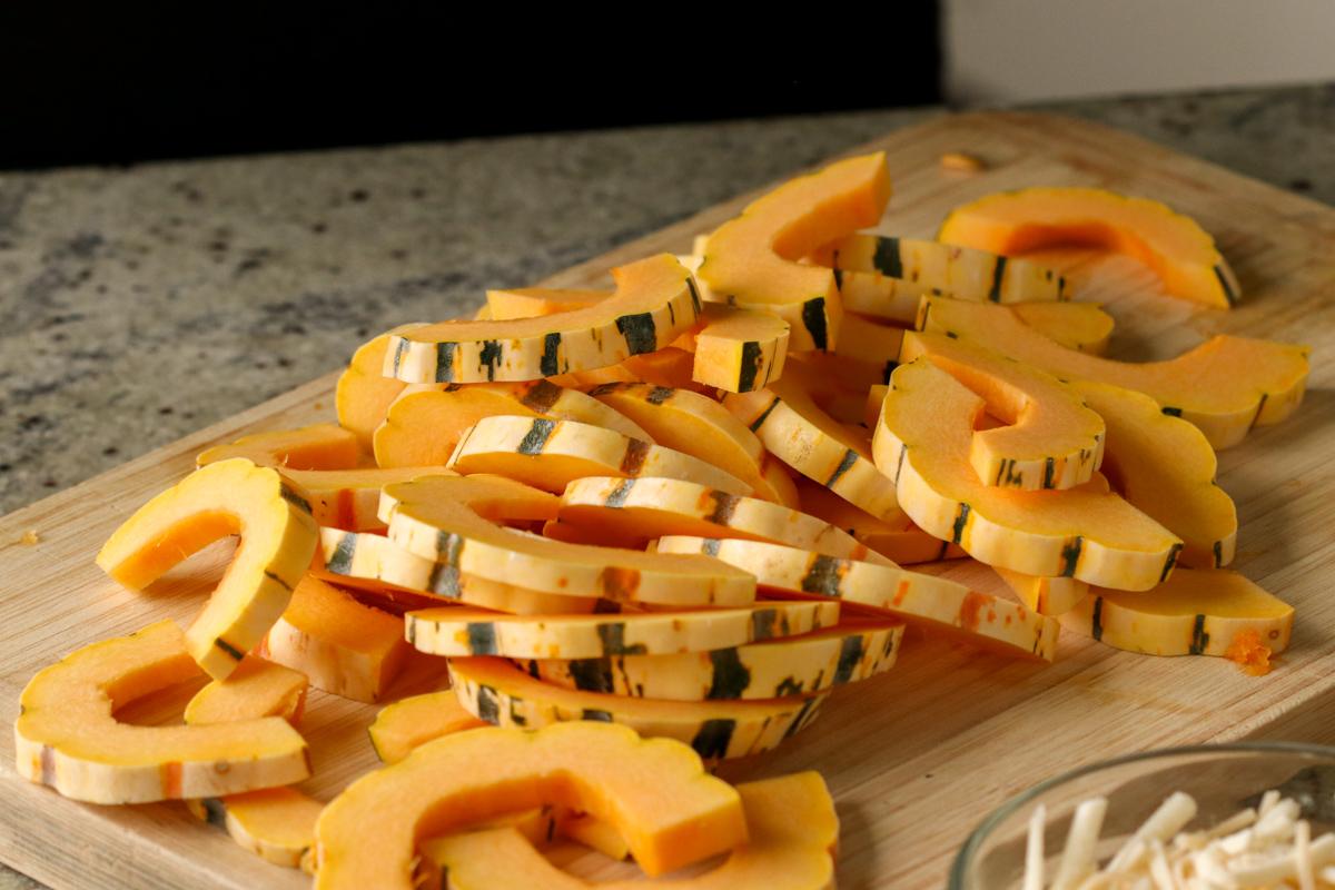 delicata squash sliced into half moons