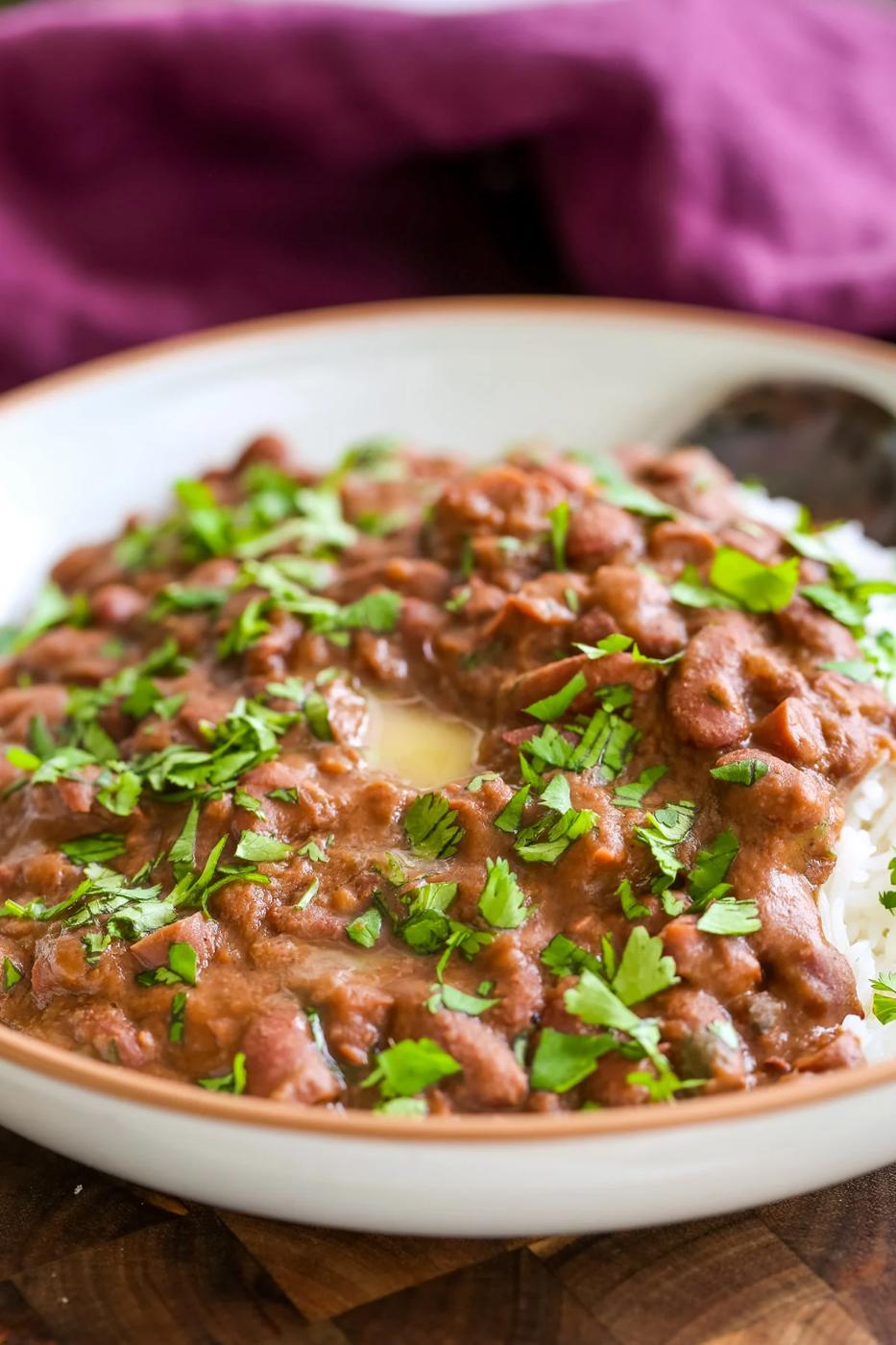a plate of Dhaba Style Rajma with rice sprinkled with cilantro