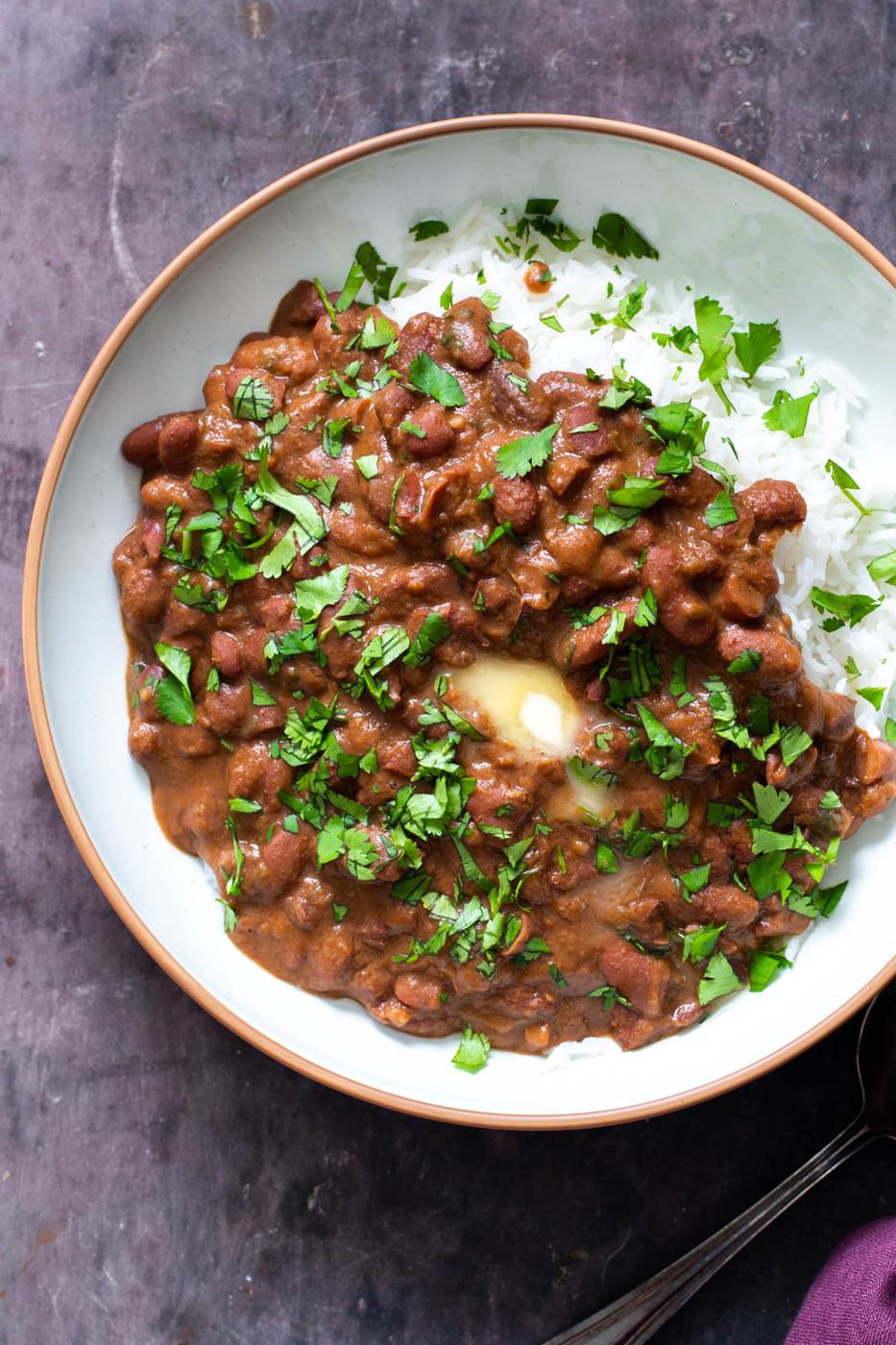 a serving of Indian Dhaba Wake Rajma Curry served with a side of rice and topped with a dollop of butter