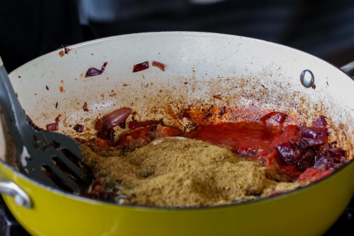 adding the ground spices to the do pyaza sauce