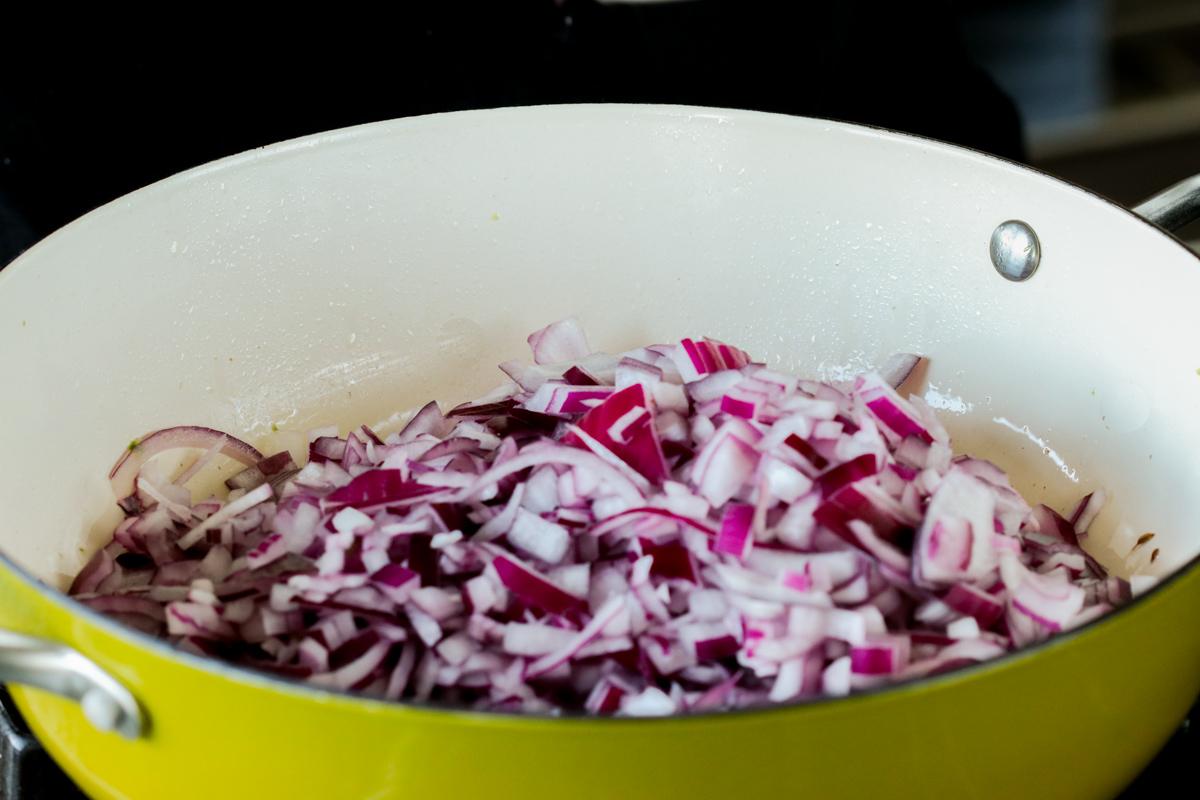 adding onion to the pan